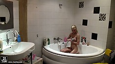 Gorgeous blonde with lovely tits, sexy legs and a perfect ass gets in the shower