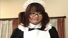 Japanese maid in uniform licking and humming a stiff baton